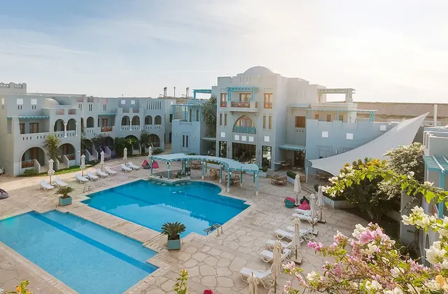 View of two pools and seating areas for guests at Fanadir Hotel, El Gouna.