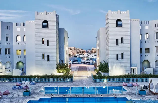 Swimming pool at Fanadir El Gouna, Red Sea, Egypt, with loungers and umbrellas.