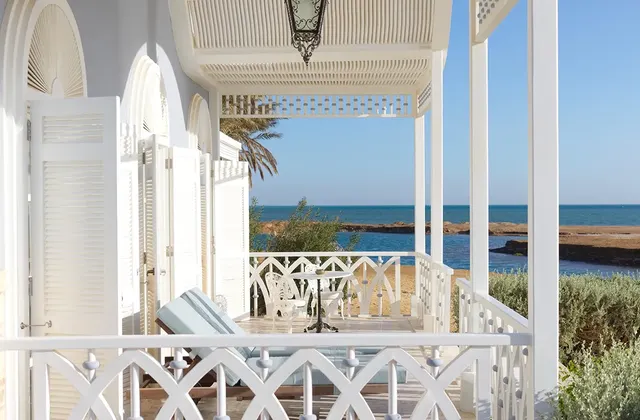 Terrace of a beachfront suite overlooking the Red Sea at La Maison Bleue El Gouna, offering a tranquil and picturesque view.